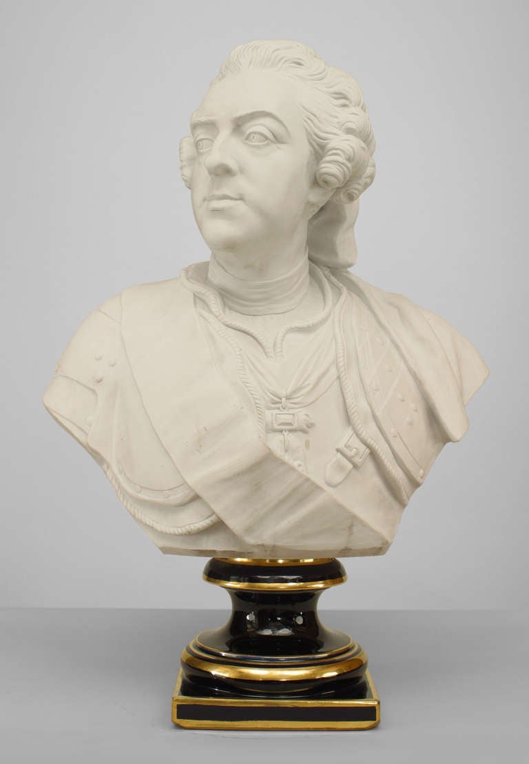 19th century French Sevres biscuit porcelain bust portraying Louis XV in aristocratic attire supported by a gilt trimmed blue socle base. The bust, modeled after an eighteenth century original, bears the signature 