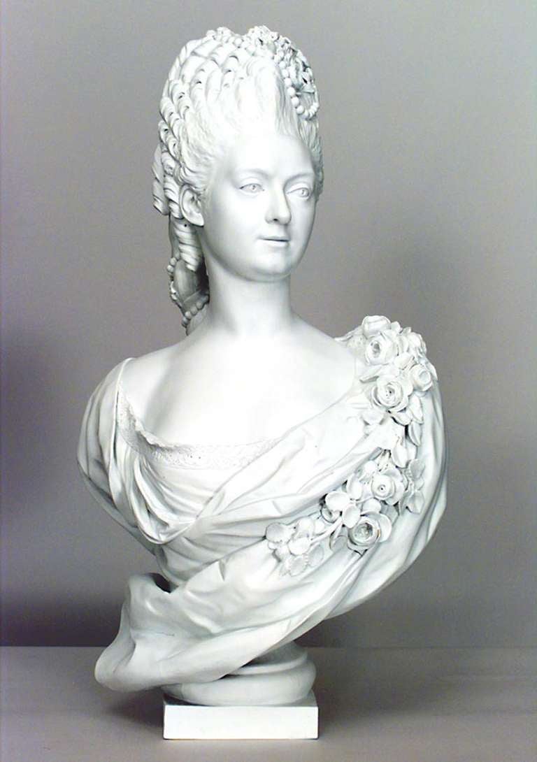 19th century French Sevres biscuit porcelain bust portraying an aristocratically coiffed and attired woman, identified as Marie-Adelaide Bourbon, daughter of King Louis XV, resting upon a socle base.