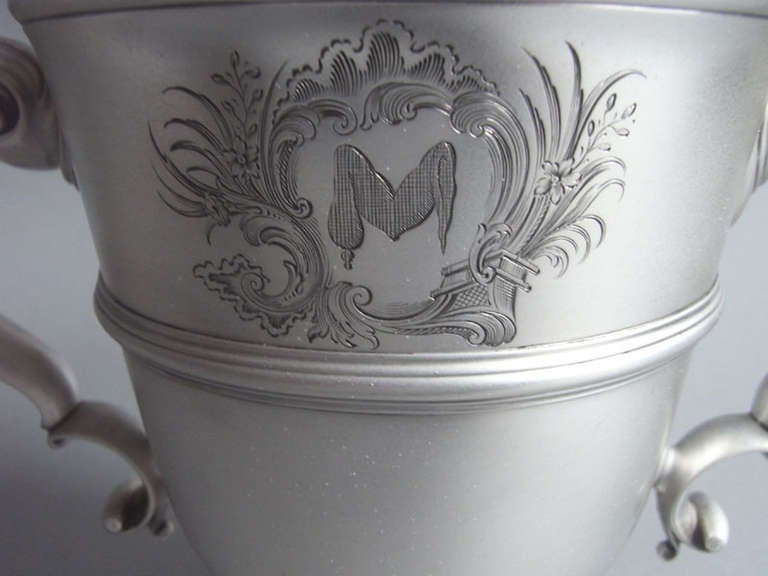 Royal Silversmith John Le Sage. An exceptional George II Two handled Cup made in London in 1732 by John Le Sage. The Cup stands on a circular spreading foot and the bell shaped body has an everted rim and an applied girdle around the upper section.