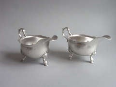 A fine pair of George II Sauceboats made in London in 1740 by Thomas Whipham & William Williams.