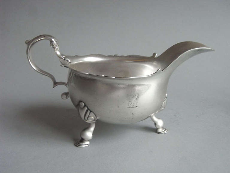 A fine pair of George II Sauceboats made in London in 1740 by Thomas Whipham & William Williams.
