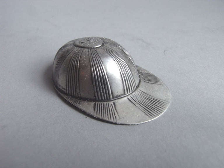 The caddy spoon is modelled as a Jockey cap and is decorated with reeded bands. The top of the domed section is engraved with a contemporary script initials.