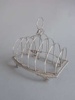 A George III Toast Rack made in London in 1818 by Crespin Fuller