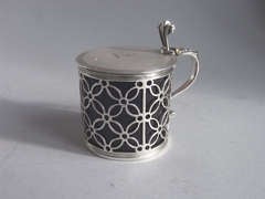 A rare early George III Mustard Pot made in London in 1768 by Samuel Herbert & Company.