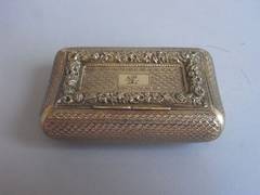 A George III Silver Gilt Curved Pocket Snuff Box made by Joseph Willmore.