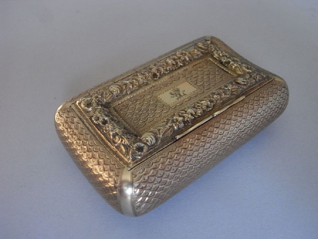 A George III Silver Gilt Curved Pocket Snuff Box made by Joseph Willmore.