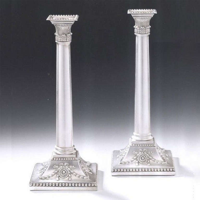 An unusual pair of George III Candlesticks