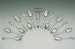 An extremely rare set of George II cast Apollo Teaspoons and Sugar Nips.