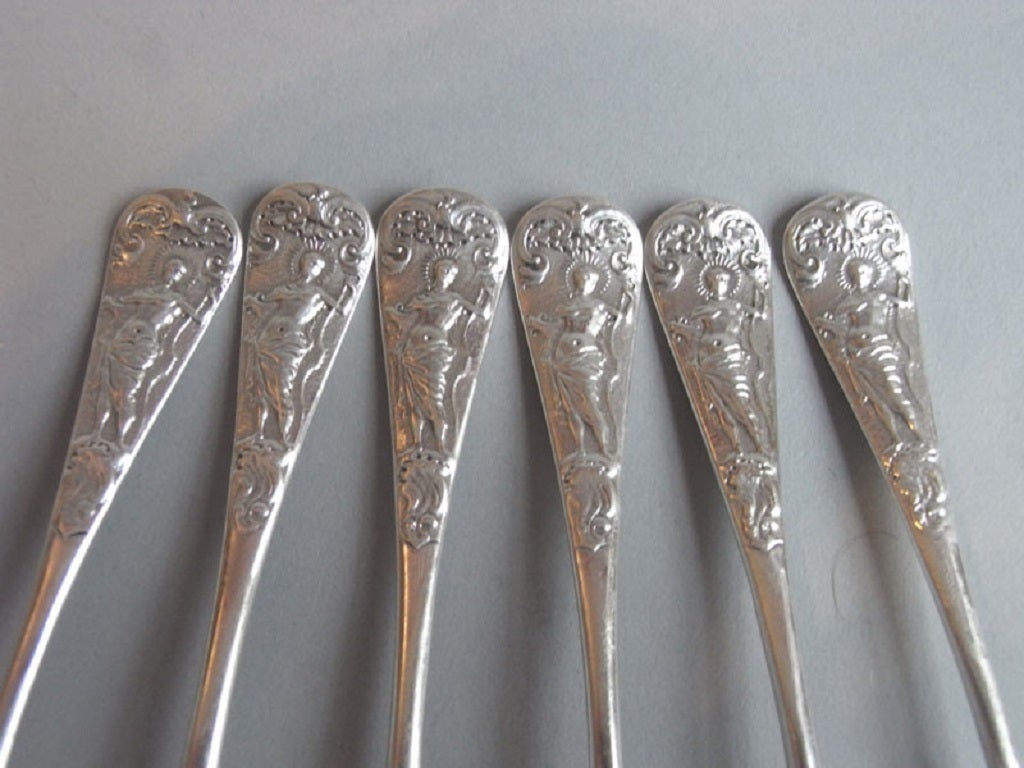 An extremely rare set of George II cast Apollo Teaspoons and Sugar Nips.
