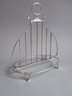 A rare George III "Lyre" Toast Rack made in London in 1796 by Naphthali Hart..
