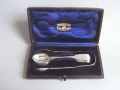 A cased set of six Coffee Spoons and Sugar Tongs made by George Adams.