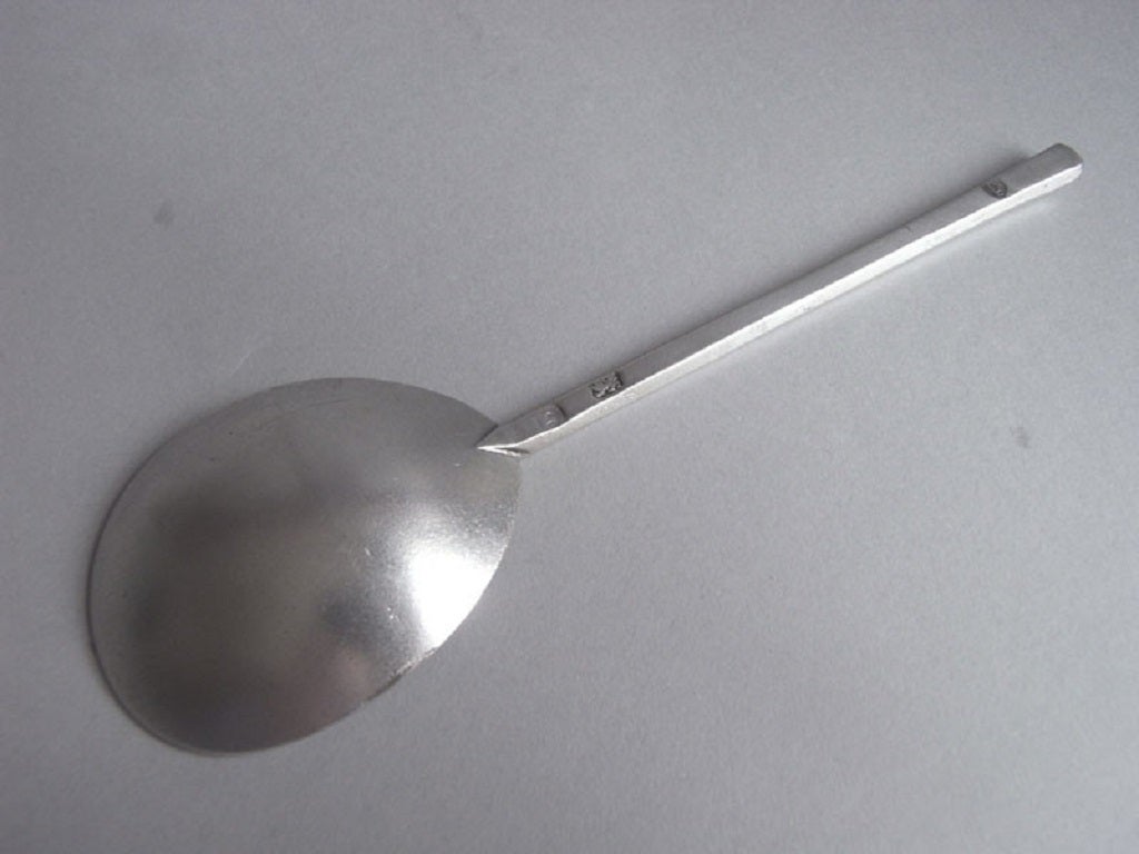 The Spoon has a fine fig shaped bowl of very good gauge. The hexagonal stem is cut off at an angle and is engraved with a set of contemporary initials. The Spoon has an excellent colour and displays very fine marks, both on the stem and in the bowl.