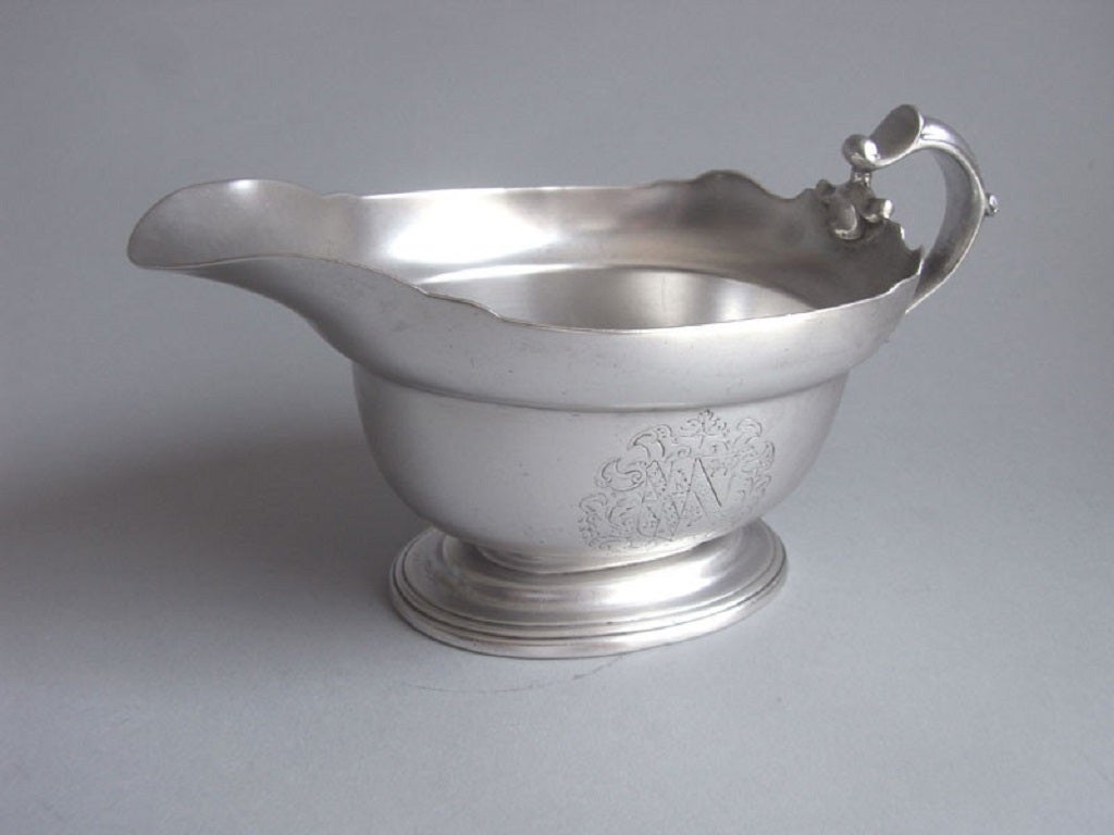 An very rare early George II Cast Sauceboat made by Peter Archambo.