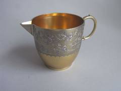 A rare silver gilt Jug of the Aesthetic movement made by Frederick Elkington.
