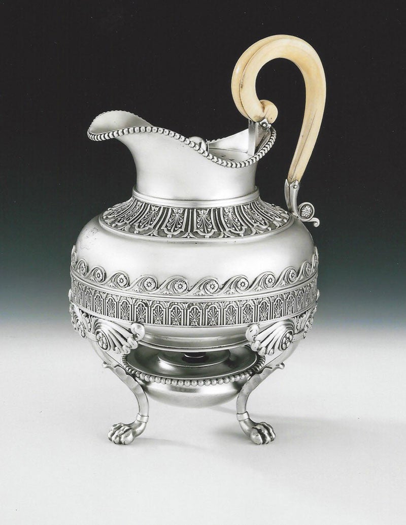 An important & exceptionally rare George III Hot Milk Jug on Lampstand