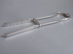 A rare pair of George III Sprung Serving Tongs made by John Buckett.