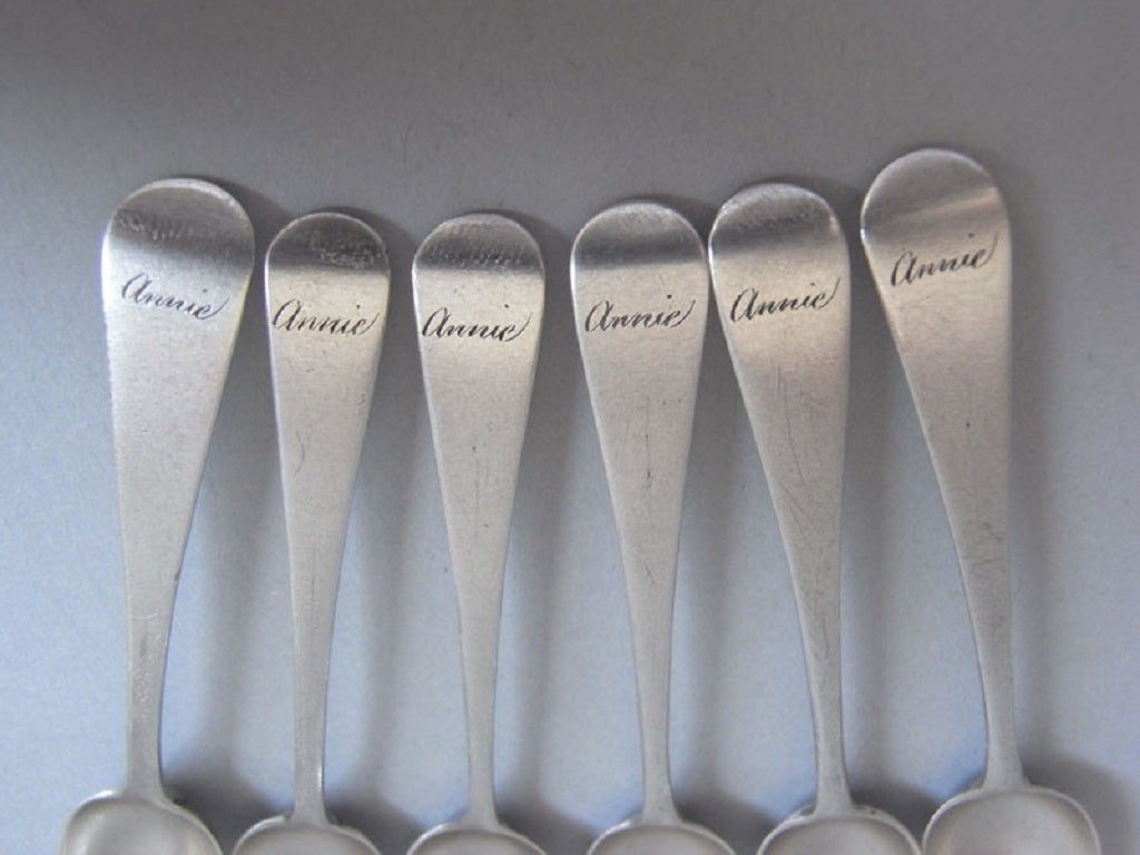 The six spoons are modelled in the Old English pattern, are well marked and have good bowls. The top of each stem is engraved with 