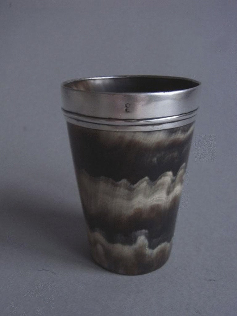 A George III silver mounted horn beaker