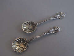 An unsual pair of cast Salt Spoons