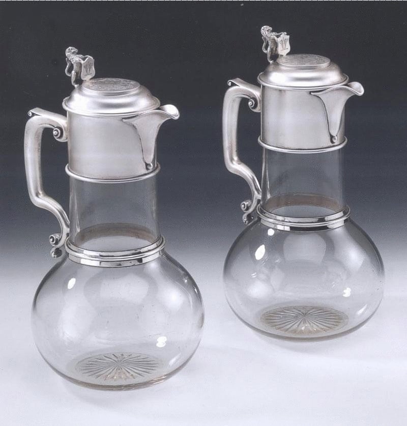An exceptional pair of silver mounted Claret Jugs