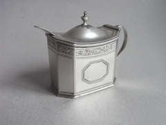 A George III mustard pot made in London in 1790 by Charles Hougham