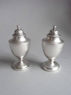 A pair of William IV Pepper Casters