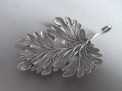 An extremely rare George III Leaf Caddy Spoon