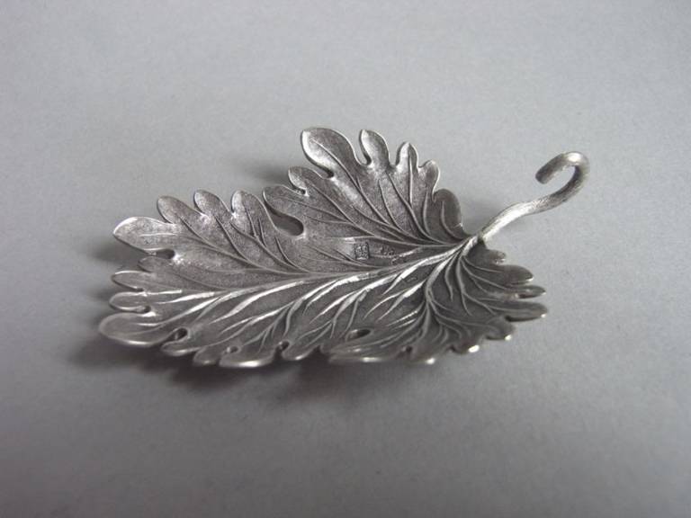 An extremely rare George III Leaf Caddy Spoon