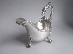An important George II Rococo Cast Sauceboat made by Issac Cookson.