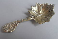 A very rare silver gilt Rococo Leaf form Caddy Spoon made by Elizabeth Eaton.