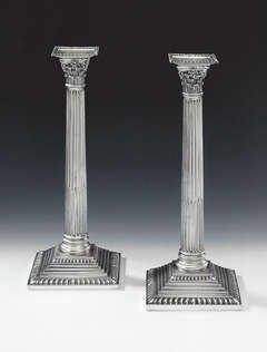 A very fine pair of Corinthian Column Cast Candlesticks made in London in 1766