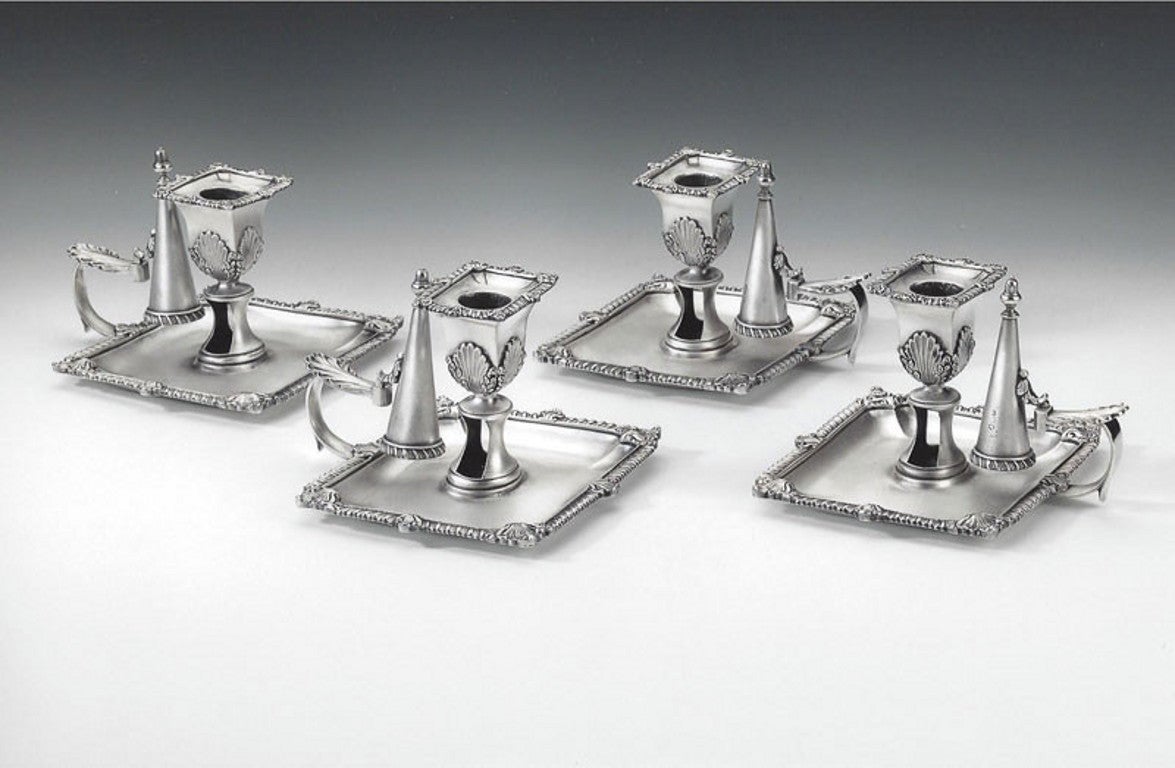 A fine & unusual set of four George III Chamber Candlesticks made in London