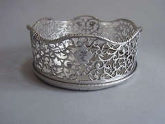 An exceptionally fine George III silver based Wine Coaster made in London