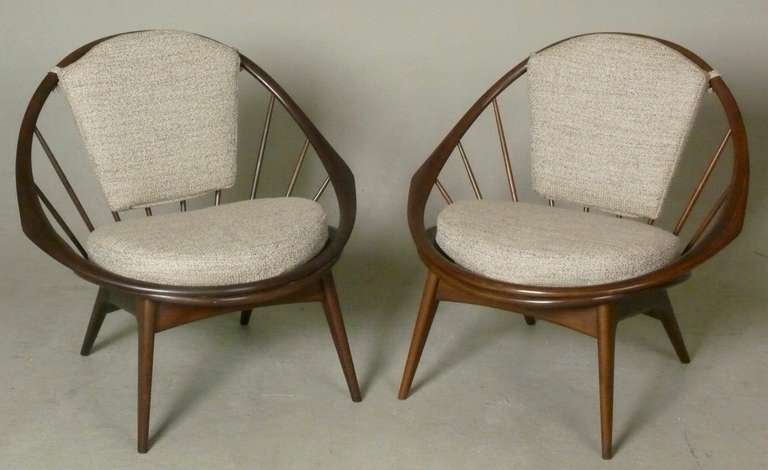 Pair of c. 1960 chairs designed by Ib Kofod-Larsen for Selig.  This unique pair of mid-century modern Windsor-style has been restored with new nubby upholstery.