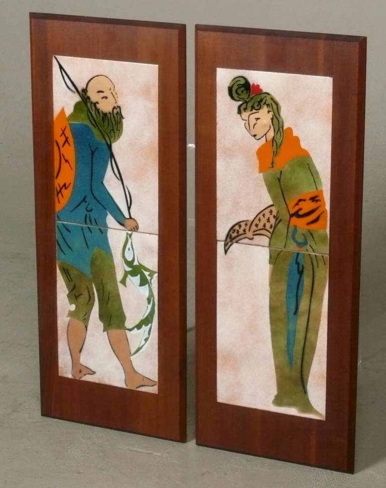C. 1955 pair of original enamel over copper Asian themed two panel wall plaques by Judith Daner mounted on an oiled walnut base frame.