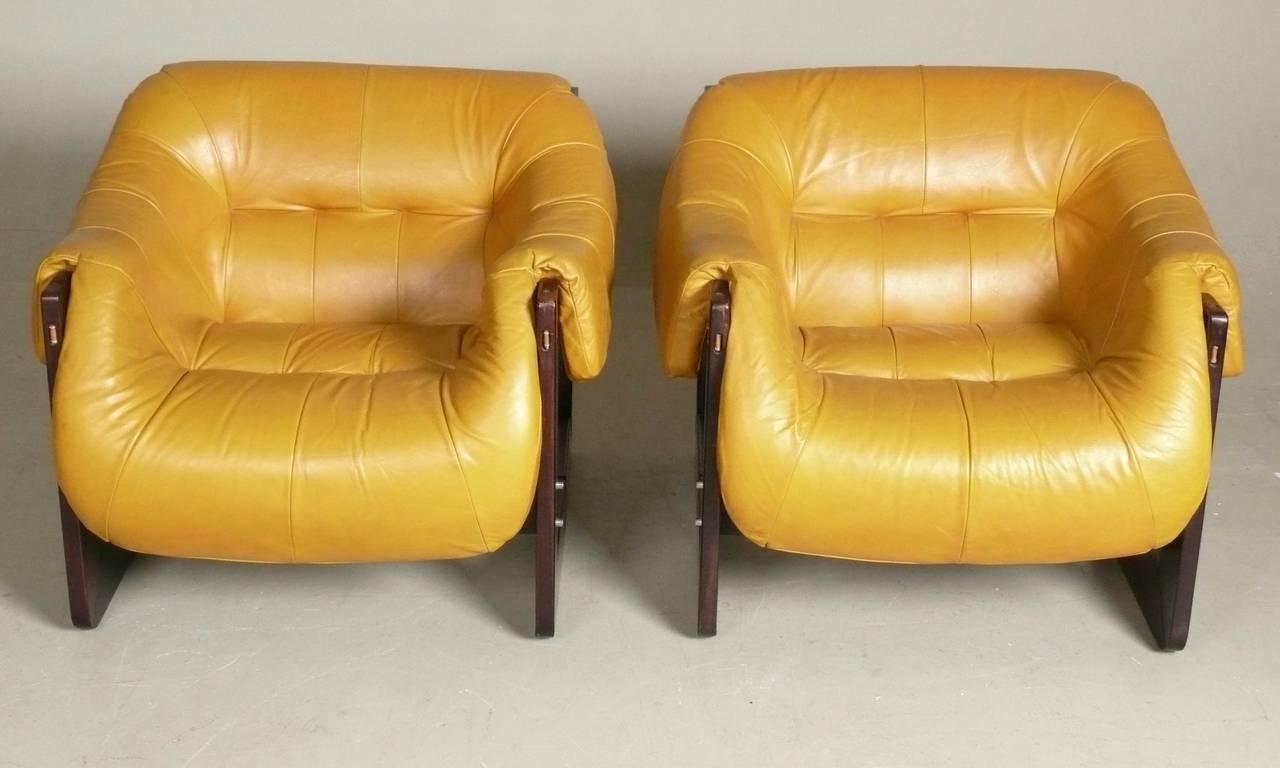 Pair of C.1970 Leather & rosewood sling style lounge chairs from Brazil by Percival Lafer.