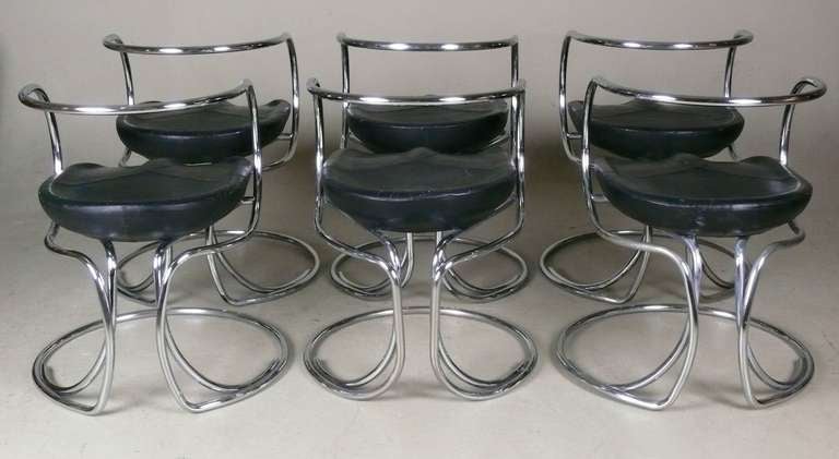 Very rare set of 6 dining armchairs in chromed tubular steel with molded foam seats covered in original black leather designed in 1927 by Vladimir Tatlin. This set was manufactured in Italy in the 1950's by Nikol Internazionale & has the Nikol