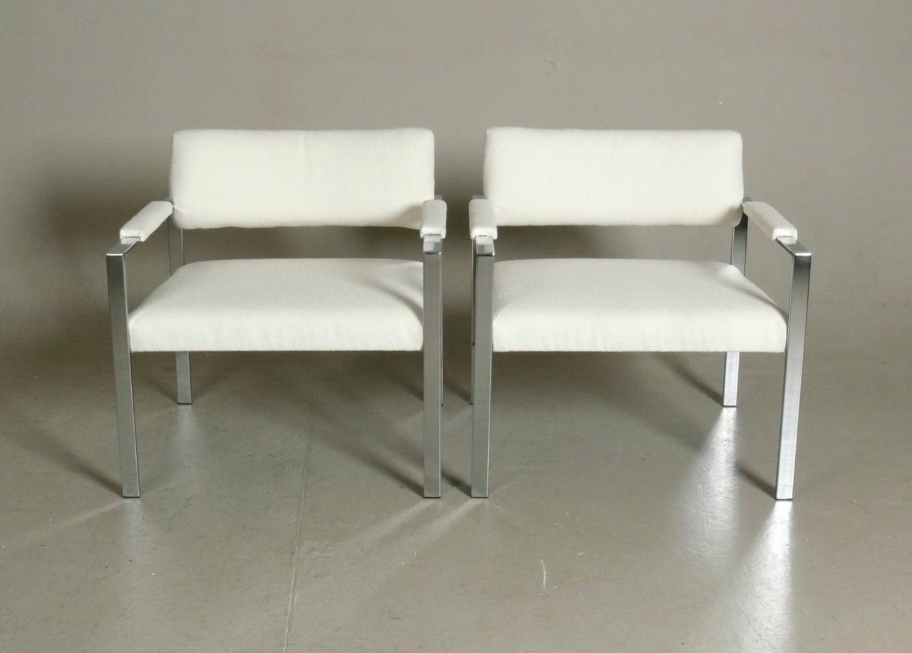Large-scale club chairs in chrome attributed to Milo Baughman.  Reupholstered in luxurious Ivory boucle.  Chrome is bright and shows only minor wear to be expected with age.