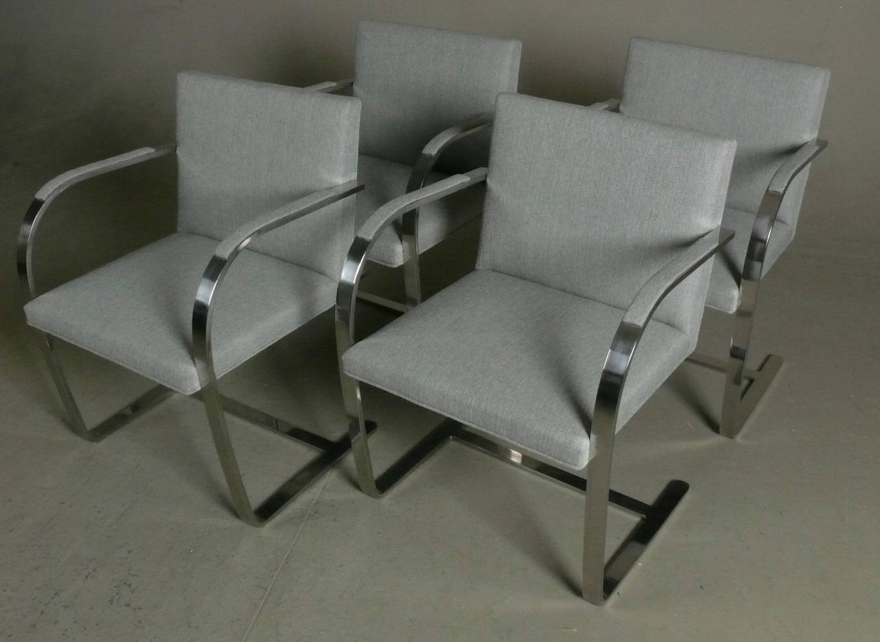 Set of 4 1970s solid stainless steel flatbar Brno chairs designed by Ludwig Mies van der Rohe and made by Brueton. New upholstery.