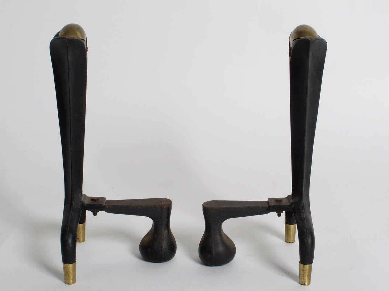 Pair of Donald Deskey for Bennett andirons. Solid brass crowns and feet. Each is signed on the footer.