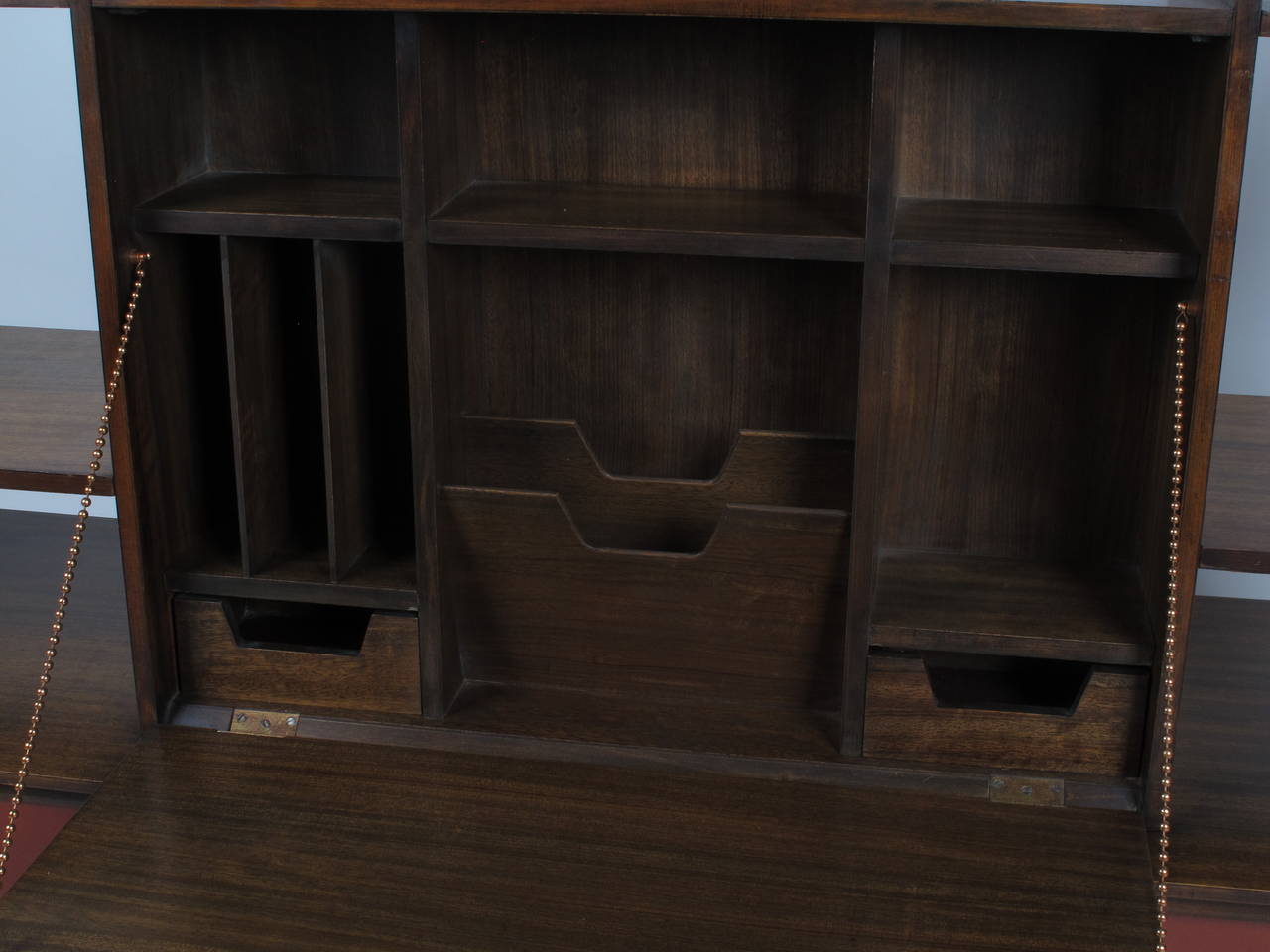 Rare custom ordered 1950s room divider by Milo Baughman for Drexel in Mindoro wood with a drop down desk on 1 side, a drop down cocktail area on the other as well as 2 adjustable shelves, 4 sliding doors & the original key.