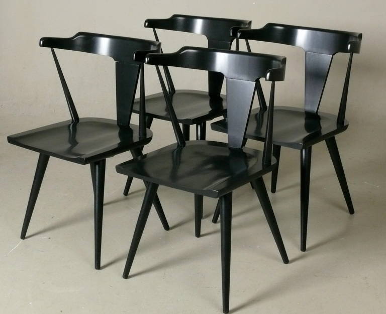 Set of 4, black lacquered, solid birch dining chairs designed by Paul McCobb for his Planner Group line by Winchendon, late 1950s. Restored and in excellent condition.