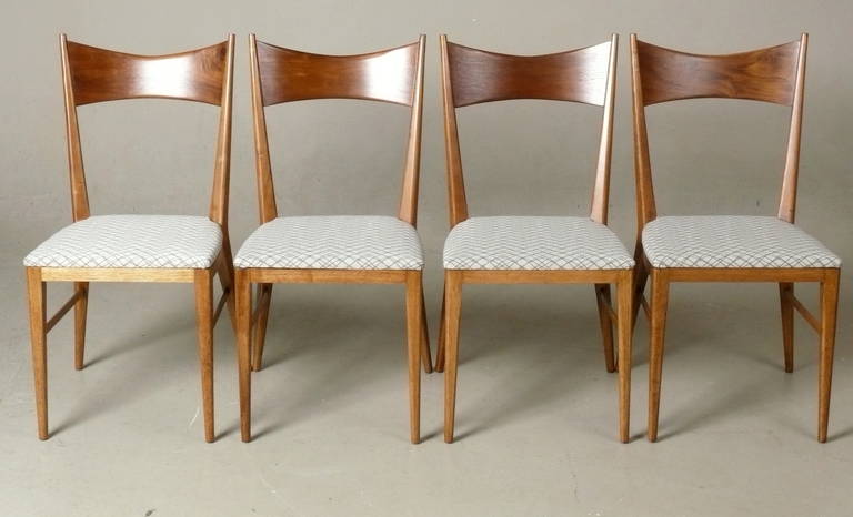 Set of 4, 1950s, walnut side chairs designed by Paul McCobb for Calvin.  The beautifully grained walnut has been fully restored to excellent condition.
