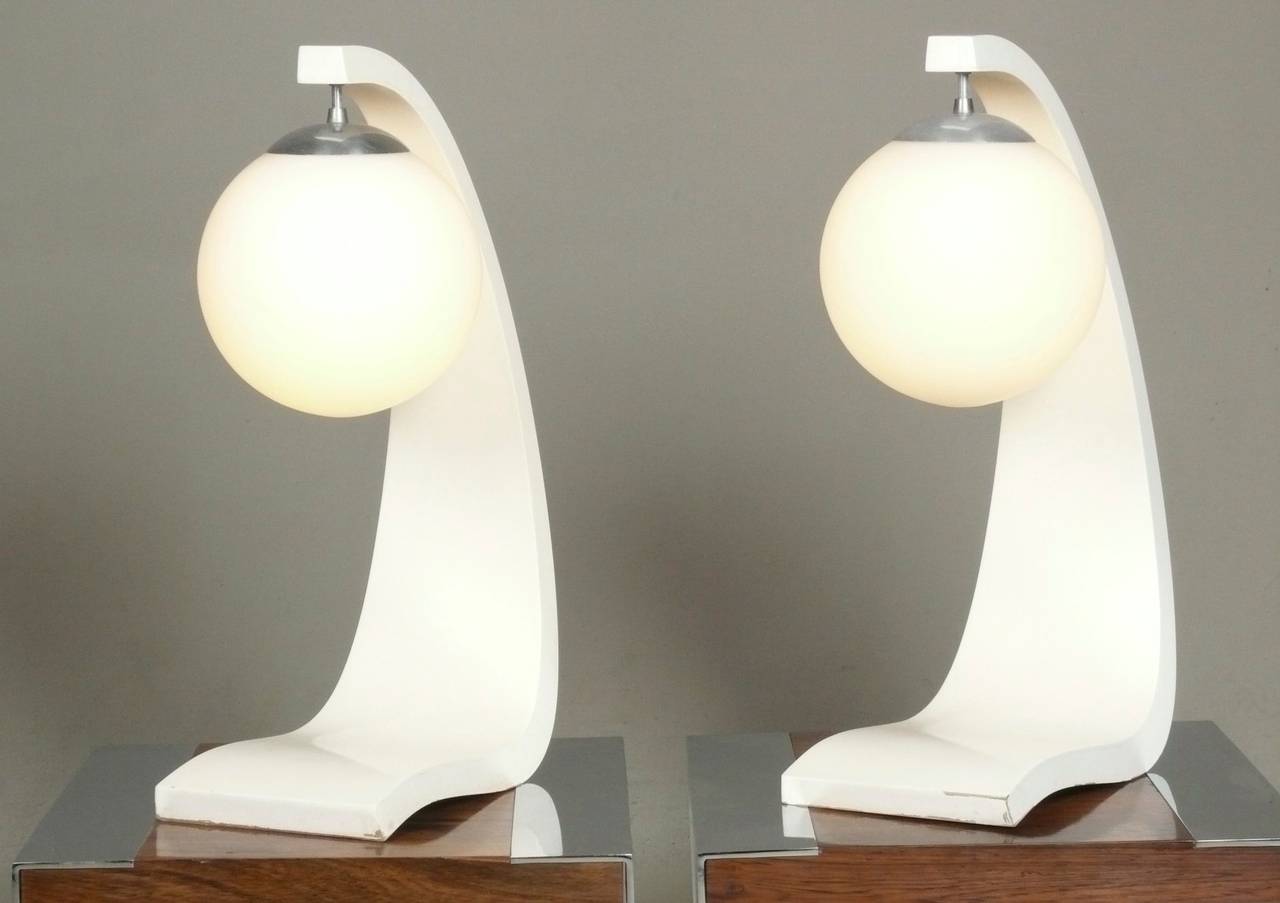 Pair of c. 1970, sculptural molded wood lamps by Modeline of California.  Original white lacquered finish has softened to a consistent ivory.