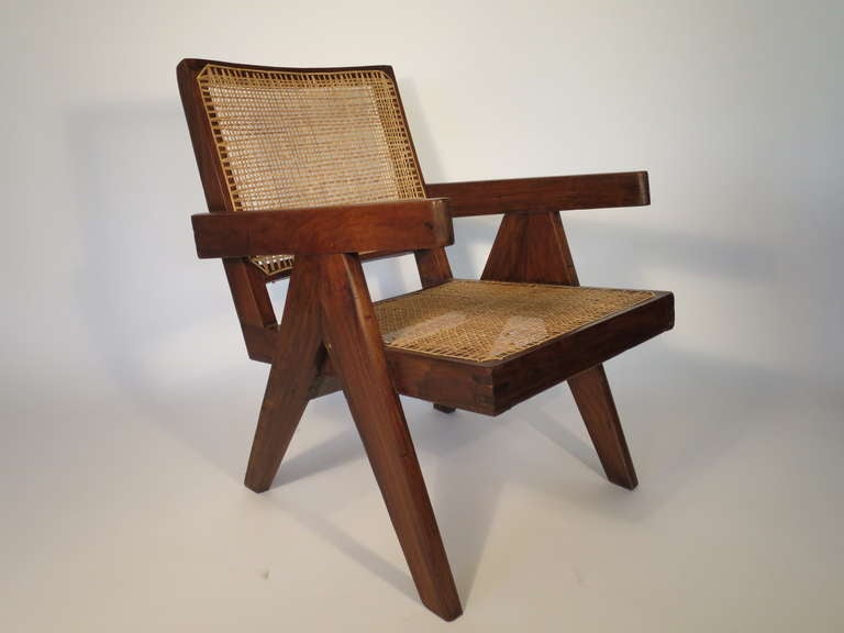 Pair of exquisite cane and teak wood Easy armchairs c. 1955-56 by Pierre Jeanneret. From Chandigarh, India. Chairs previously located in the General Hospital, campus and administrative buildings built by Jeanneret's cousin, Le Corbusier. Refinished
