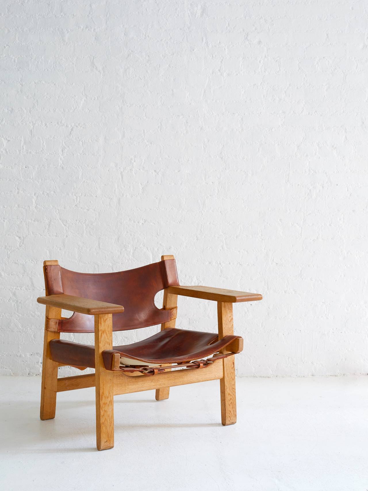 Iconic Borge Mogensen Spanish Chair with superlative patina. 

Thick cognac leather is exquisite with age; beautiful oak frame.