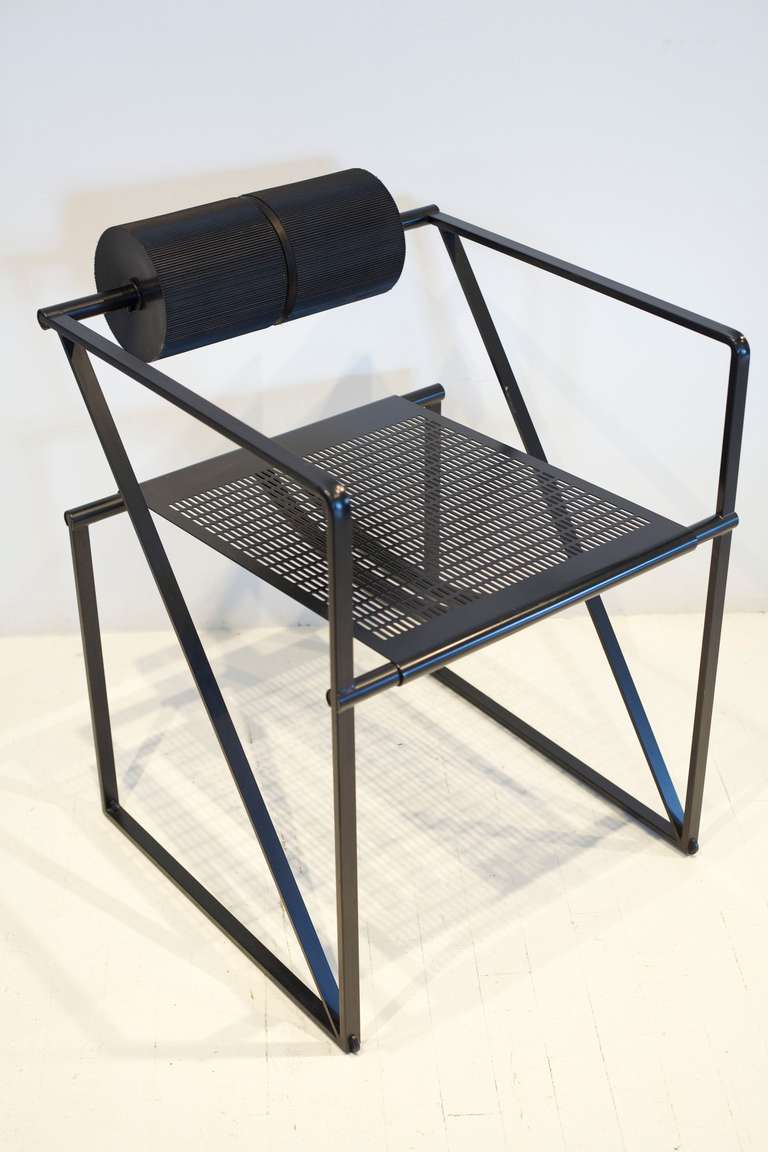 The geometric Botta Seconda 602 armchair. The seat features a perforated sheet metal which has bounced and unique spinning foam rollers.

1 remaining. 