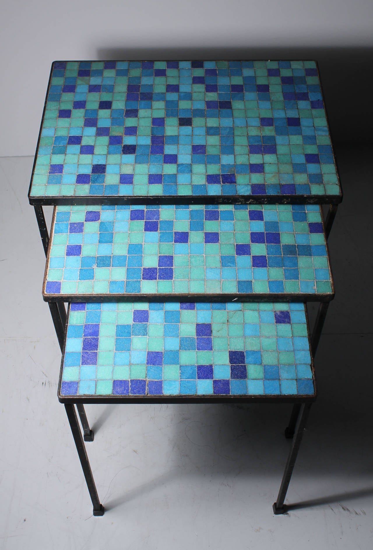 Vintage Mosaic Tile Nesting Tables. Beautiful ocean colors!

Produced either in America or Italy.

Dimensions:
17.5