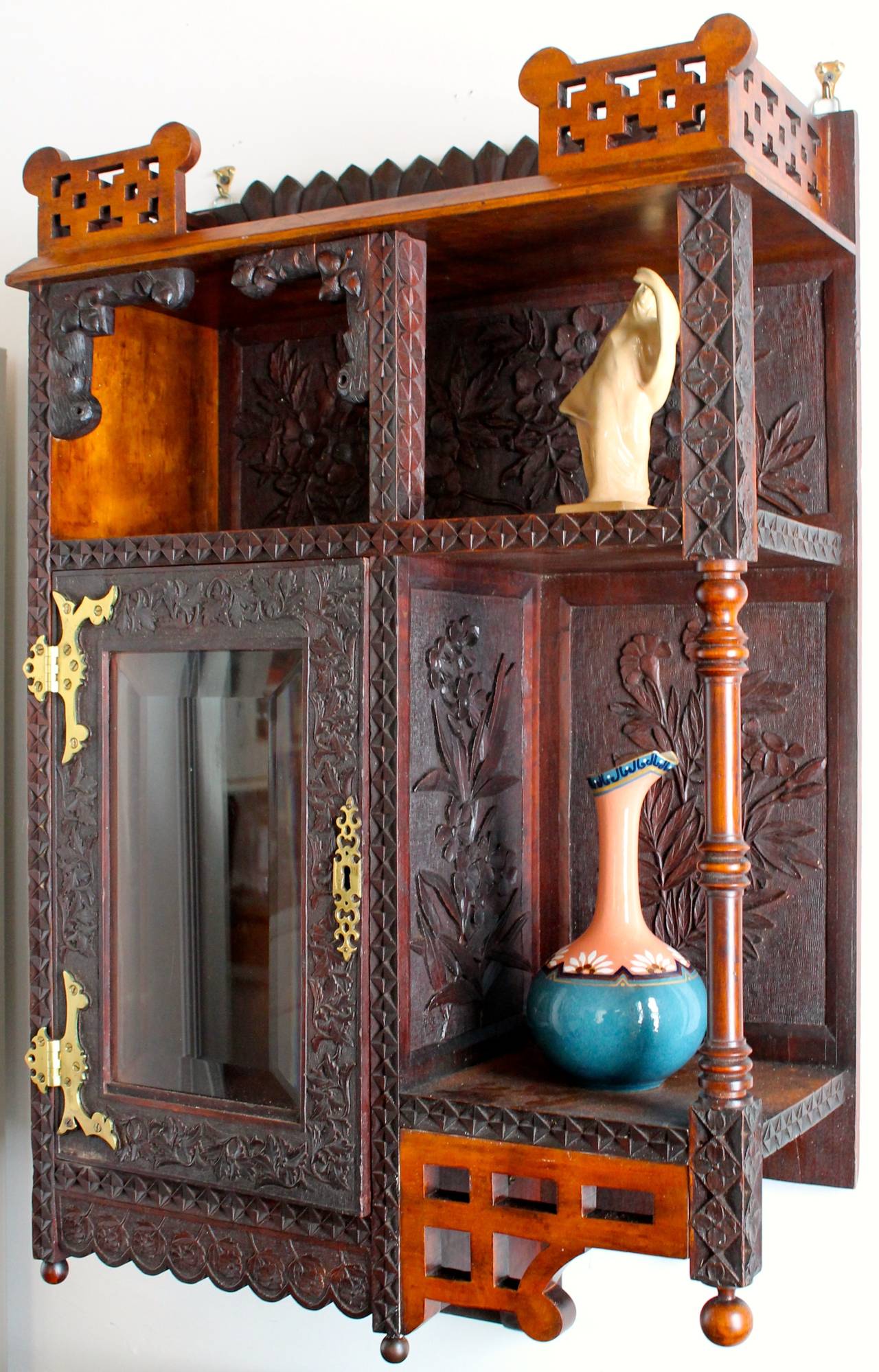 Stained oak hanging cabinet, if not by the Fry's ( Henry L. Fry 1807-1895 and William Henry Fry 1830-1929) by one the members of their 'school'.  Japonesque in manner with oak leaf and acorn motifs throughout, original surface and glazing. 