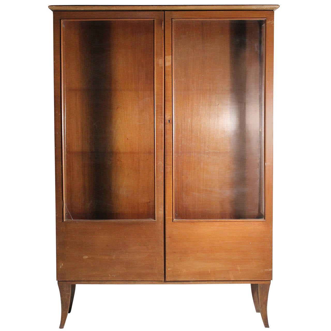 A German Austrian Deco China Cabinet. A very practical scale. Clean lines with Austrian style legs. Adjustable shelving peg holes. Would be nice to have glass cut for shelving. Please see condition report. Cabinet looks great in this finish color